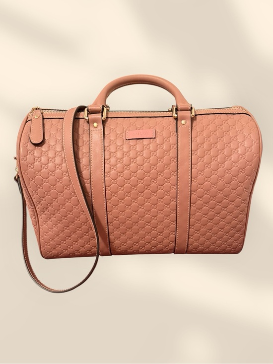 Gucci Handbags - Gucci Blush Pink Embossed Leather Travel Bag with Gold Hardware
